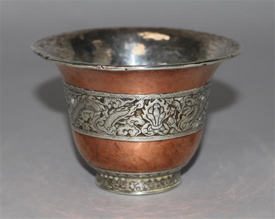 A Tibetan silver and copper flared cup, diameter 3.75in.